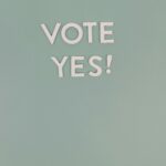 Minimalistic image with 'Vote Yes' text on a green background, ideal for political or motivational themes.